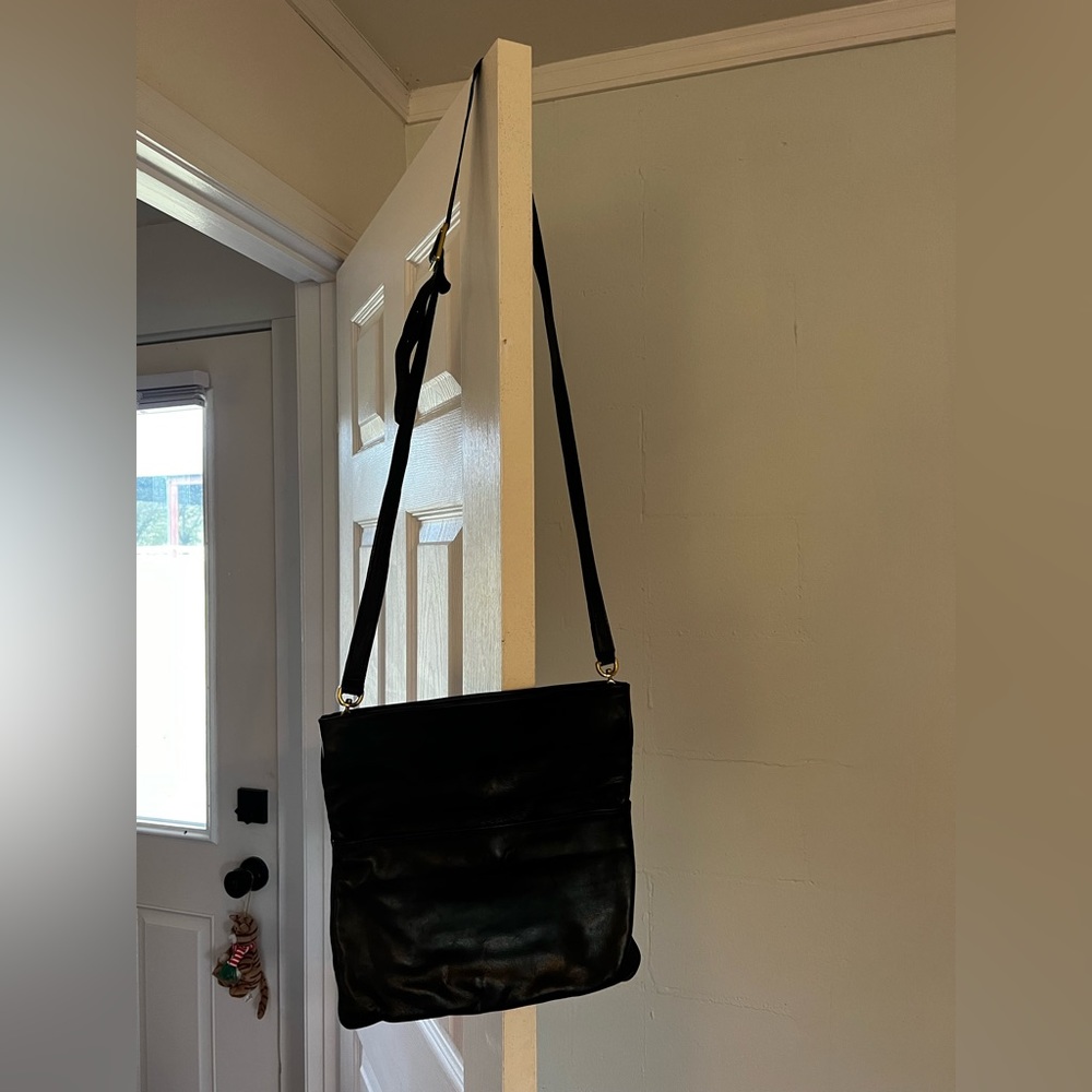 Sseko black convertible clutch/crossbody. Nice, quality leather!